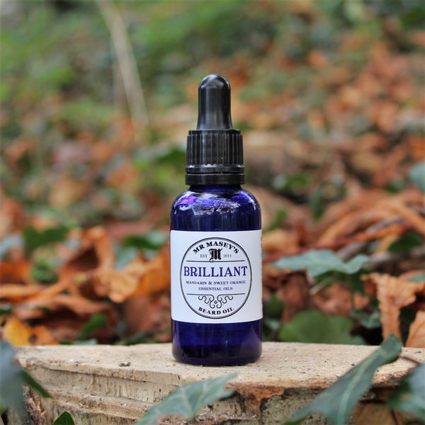 Mr Masey's Brilliant Beard Oil bottle in autumnal woodland setting