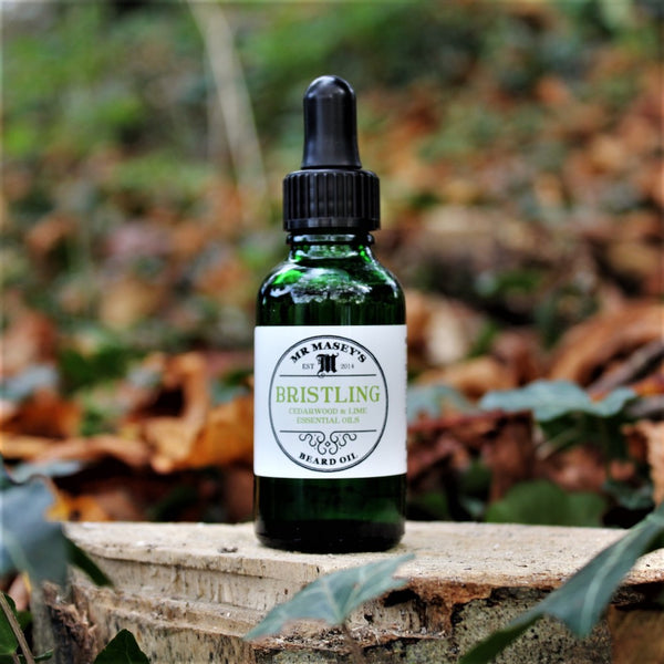 Bristling Beard Oil Bottle in autumnal woodland setting