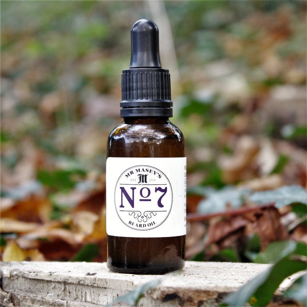 Mr Masey's No.7 Beard Oil bottle in autumnal woodland setting